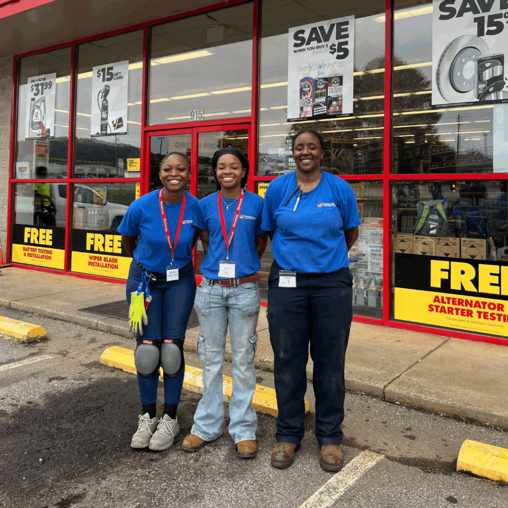 Field team posing outside a retail store after completing post-holiday retail assessments, retail store remodels resets